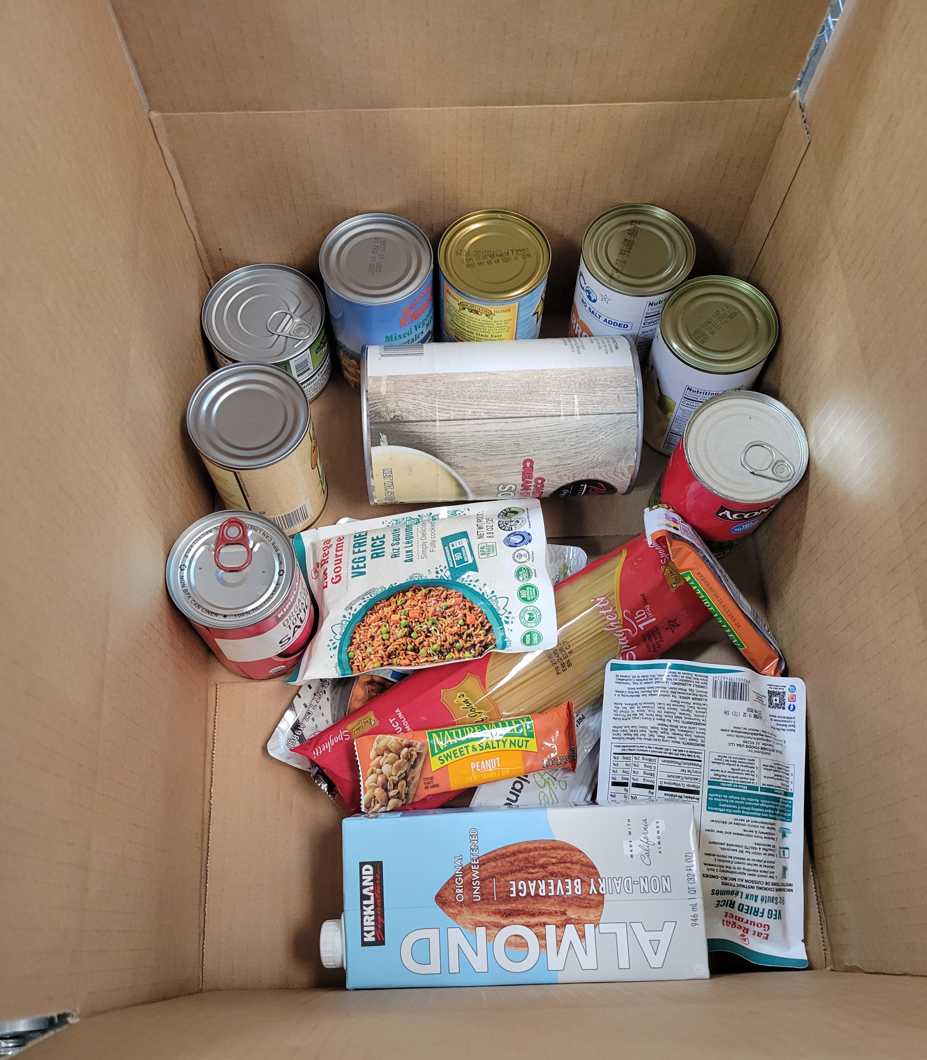 Cardboard box full of dry goods.